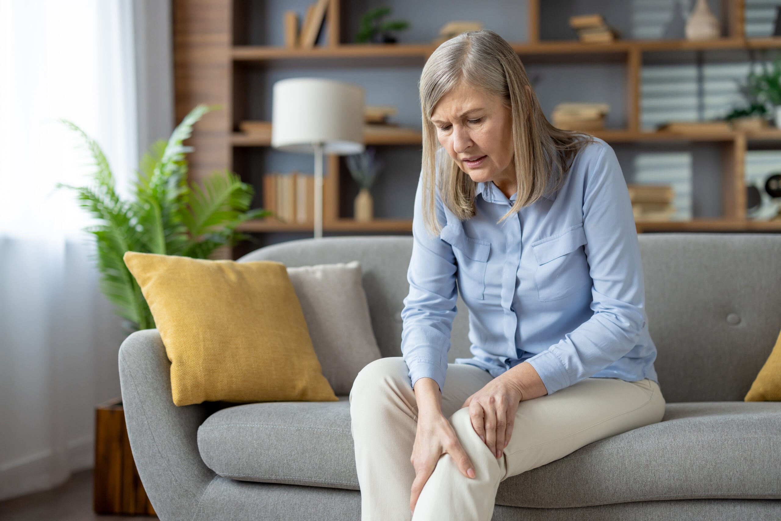 Person experiencing arthritis joint pain needing chiropractic treatment in Campbell