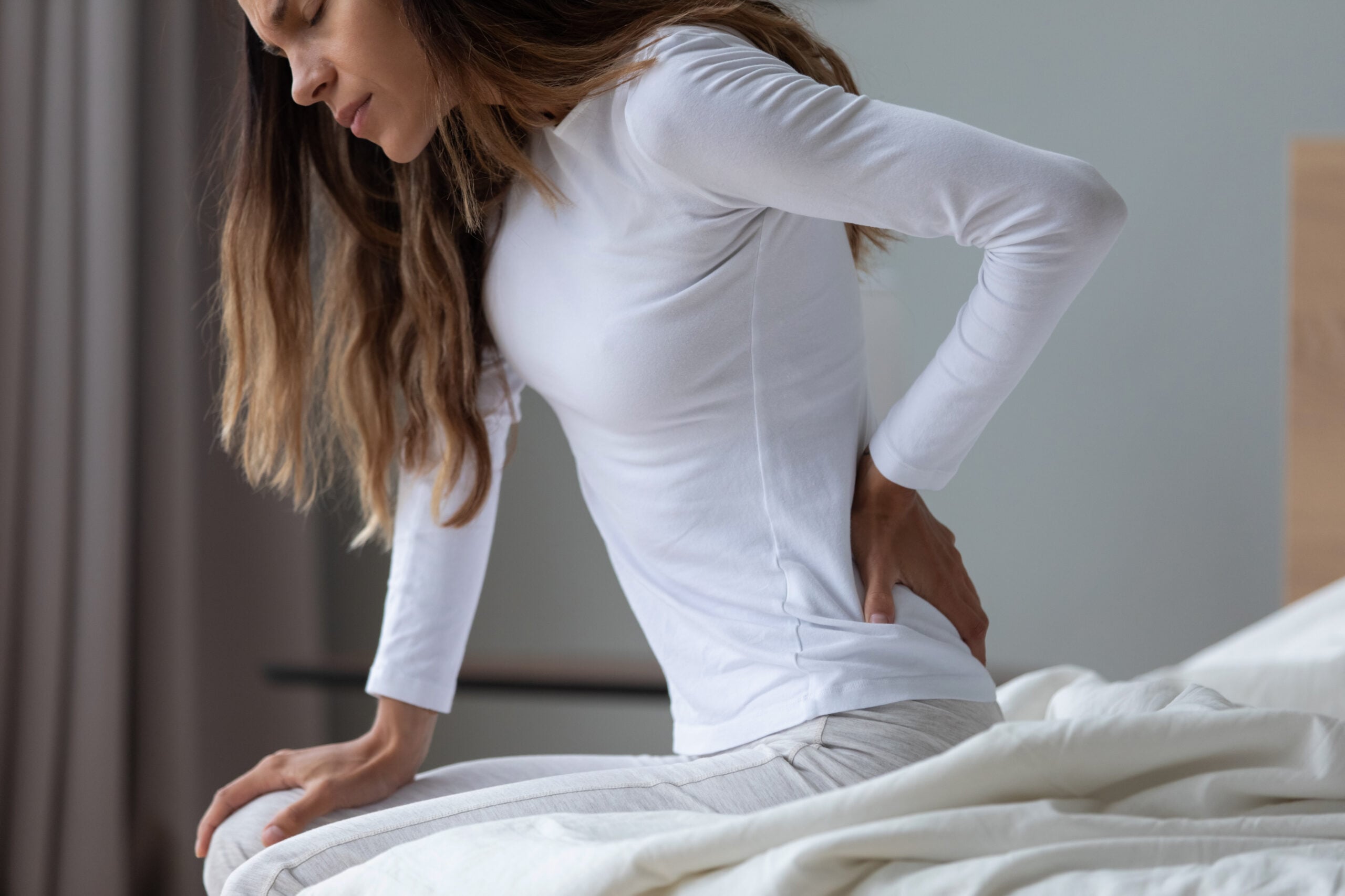 Person with herniated disc back pain requiring treatment in Campbell chiropractic clinic