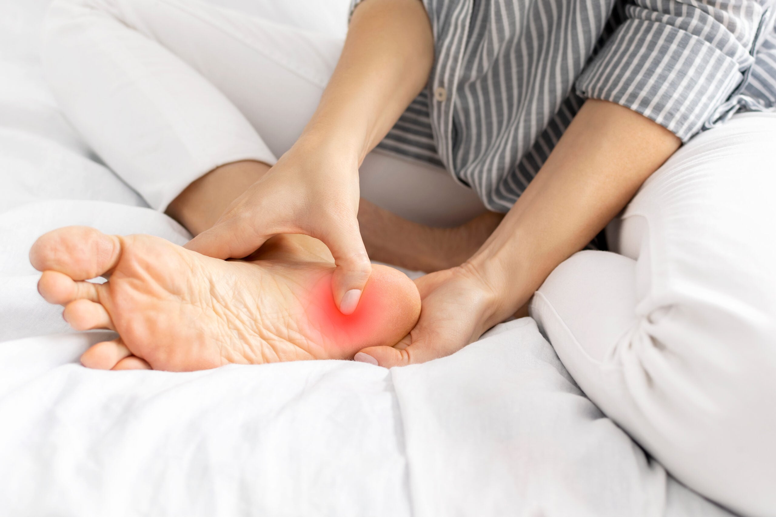 Person with plantar fasciitis foot pain needing specialized treatment in Campbell