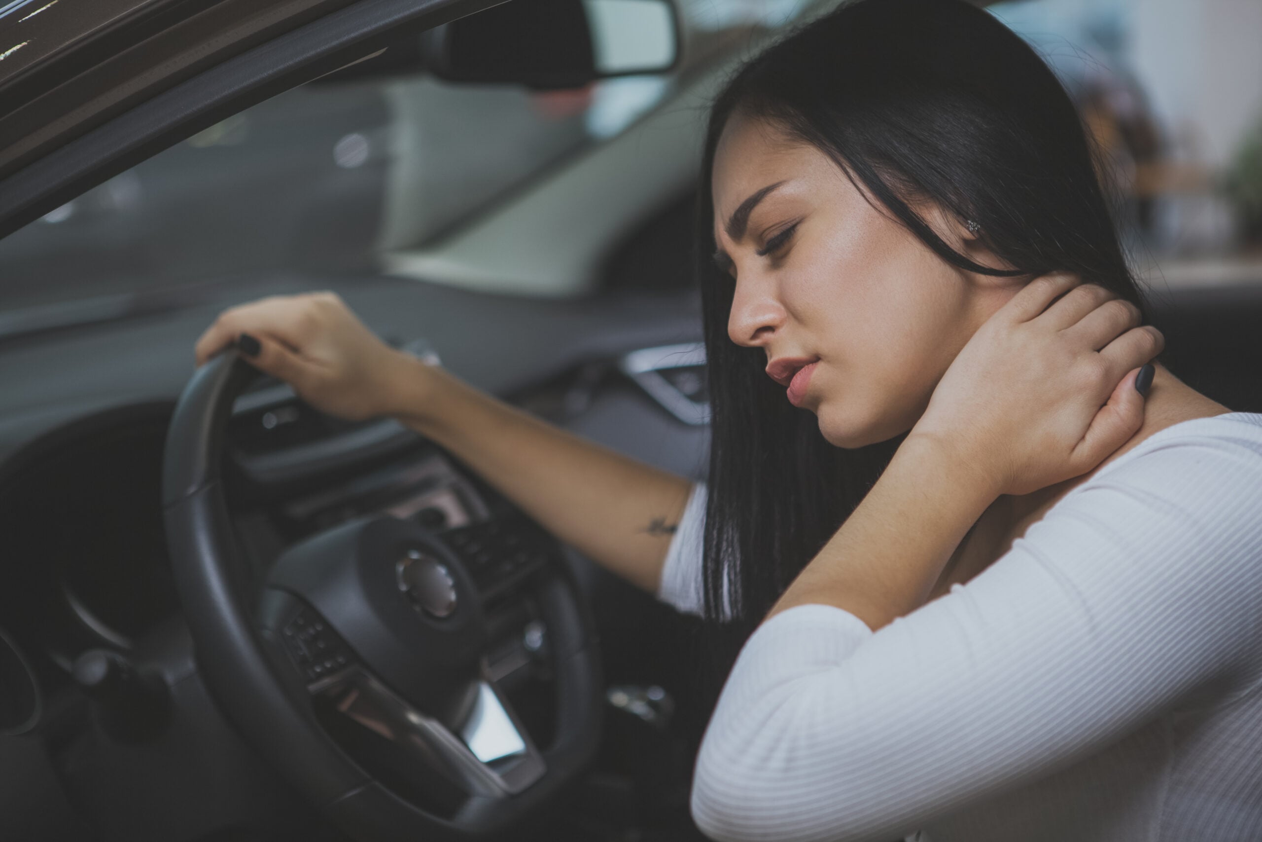 Person with whiplash neck injury from car accident needing treatment in Campbell