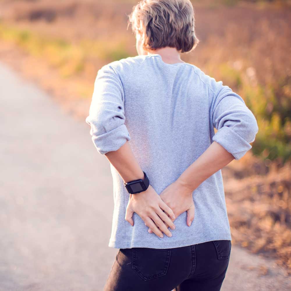 Person with hip pain needing specialized chiropractic treatment in Campbell