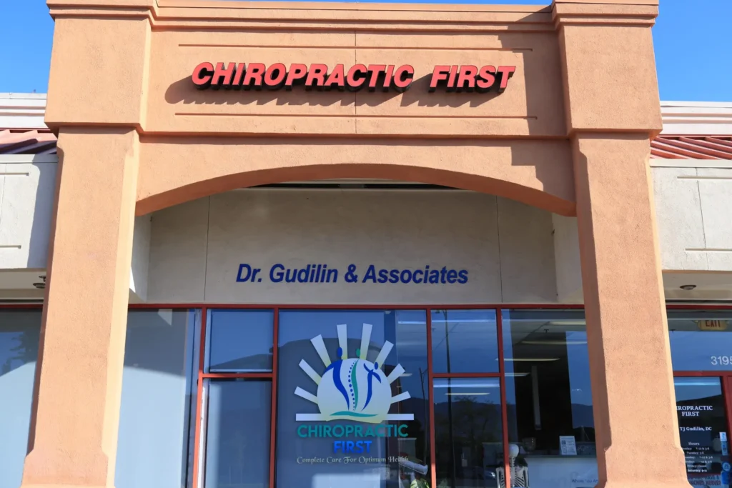 Patient consultation and chiropractic treatment at Chiropractic First